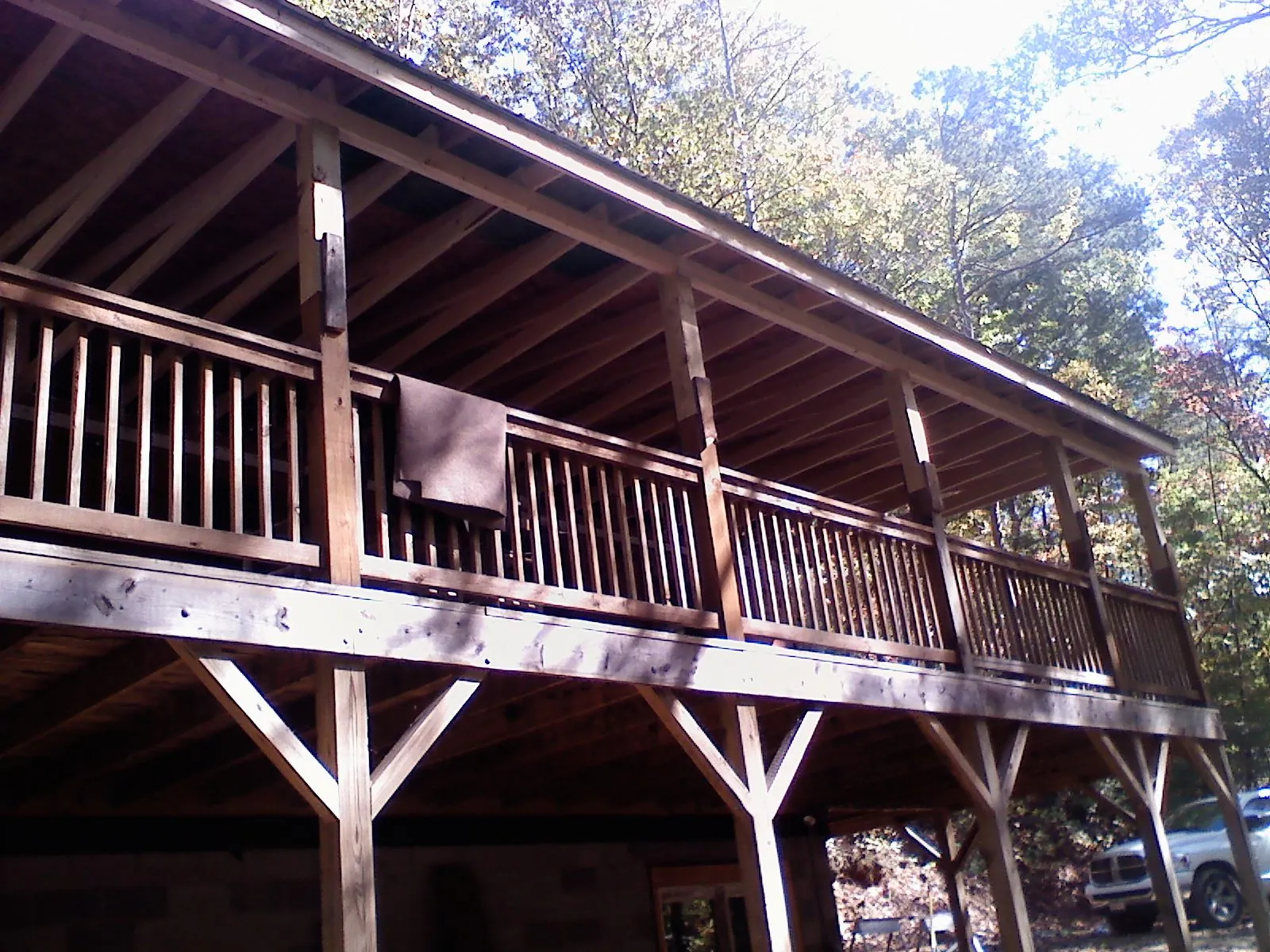 Timber framing under a new elevated porch and deck — Roof Leak Repair in Terrebonne by Roofing Brothers