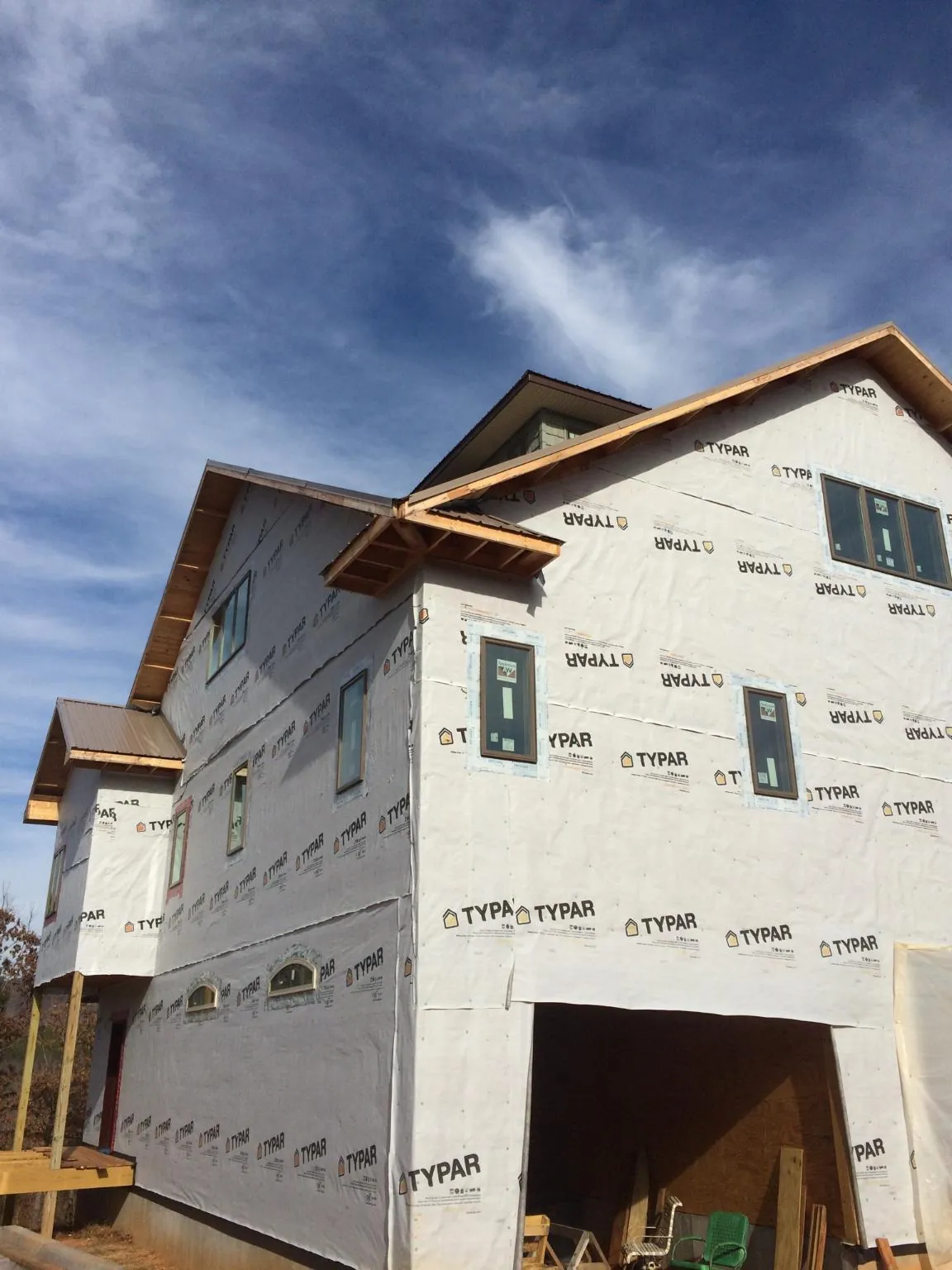 Stick built house wrapped in Typar with new roof framing and dormers in Terrebonne